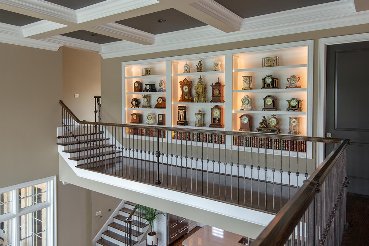 Built-in shelving and cabinetry along an upstairs landing