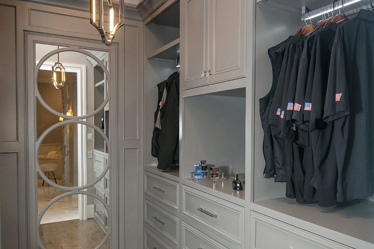 Custom closet with hanging space, drawers and a center island