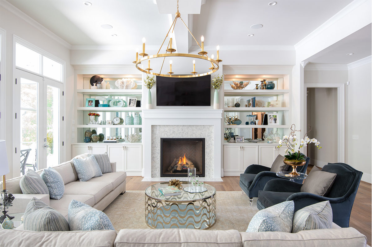 Custom built-in bookcase cabinetry flanking a fireplace