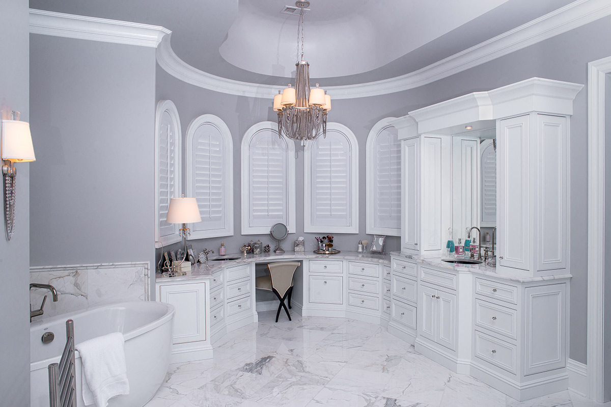 Custom bathroom vanity cabinetry with arched detailing